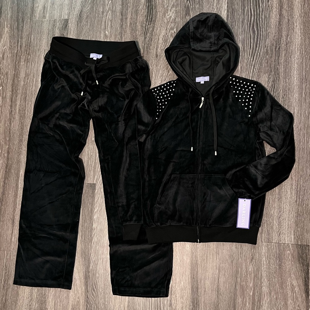 A set of pants and a zip-up sweater for casual wear.